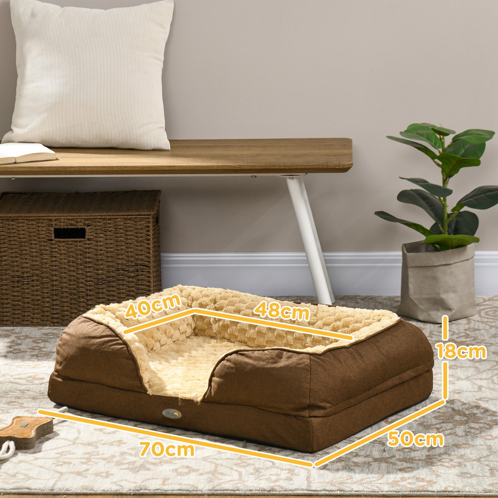 Brown pet bed with measurements in a home setting