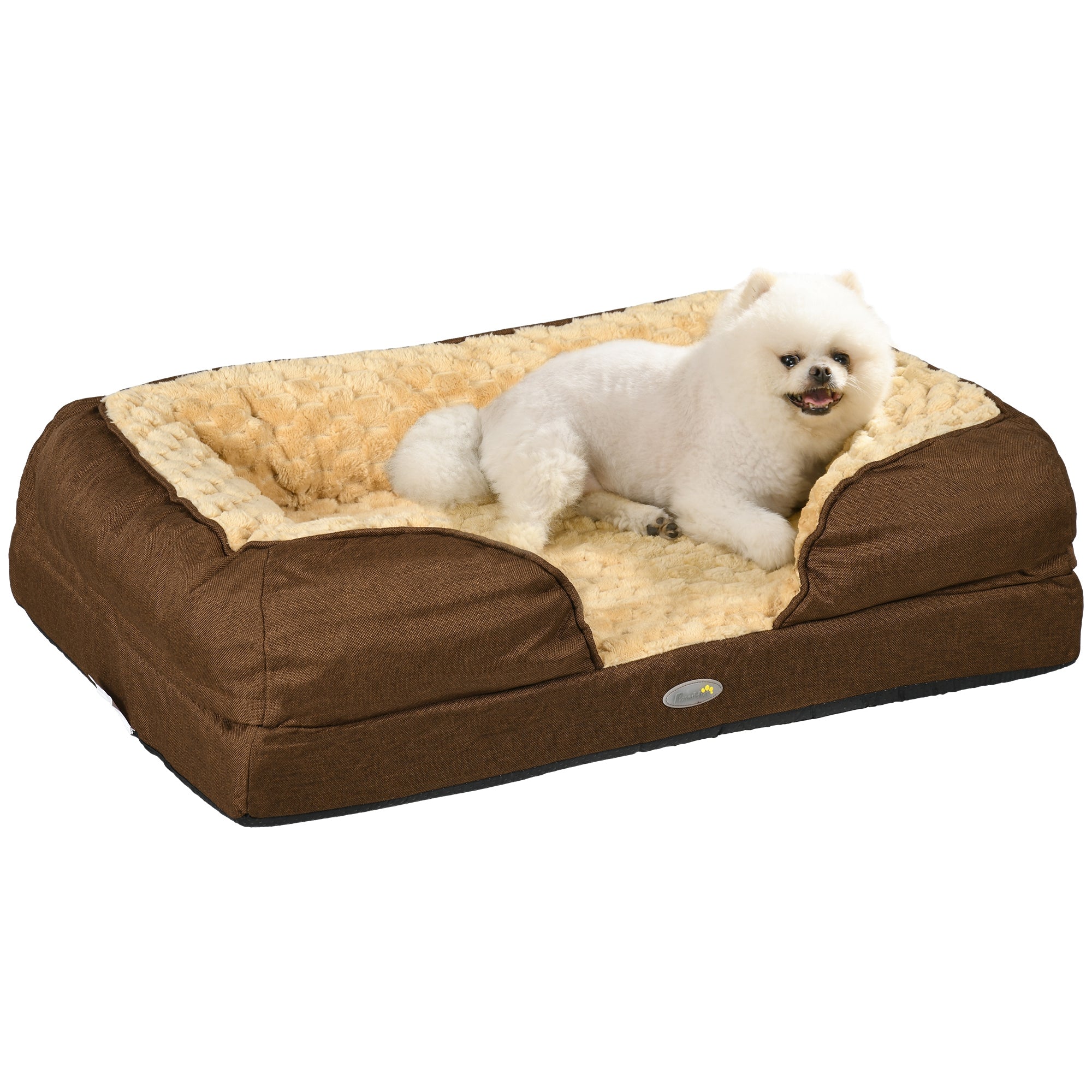 Brown and beige pet bed with a white dog on a white background
