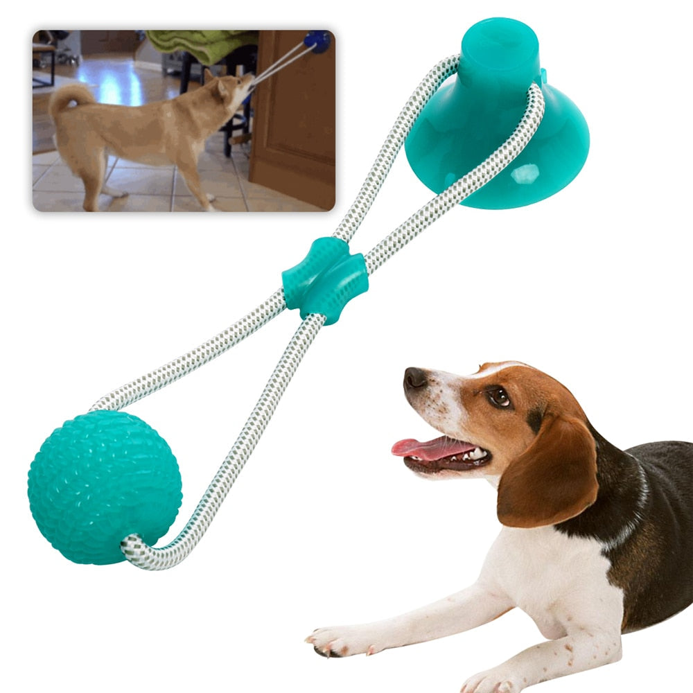 Dog toy with multiple balls and a dog playing with it on a white background