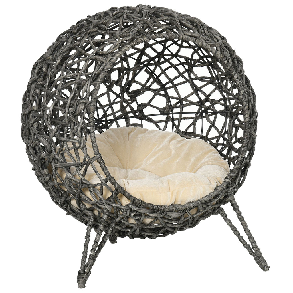 Wicker egg-shaped chair with a cushion on a white background