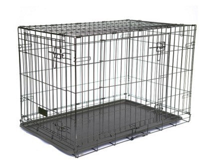 Black metal dog crate on a white background