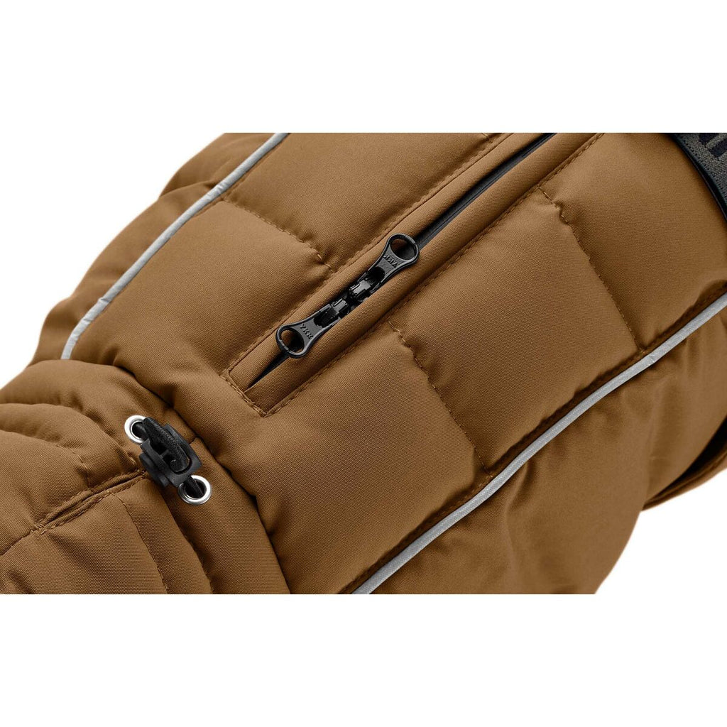 Close-up of a brown quilted bag with zippers on a white background