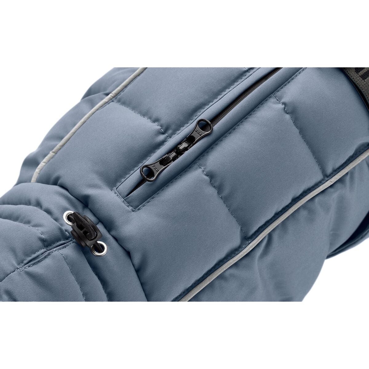 Close-up of a blue puffer jacket with a zipper on a white background