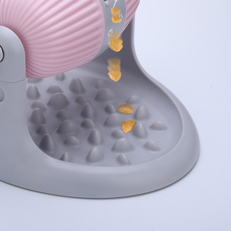 Gray pet feeder with pink top on a white background