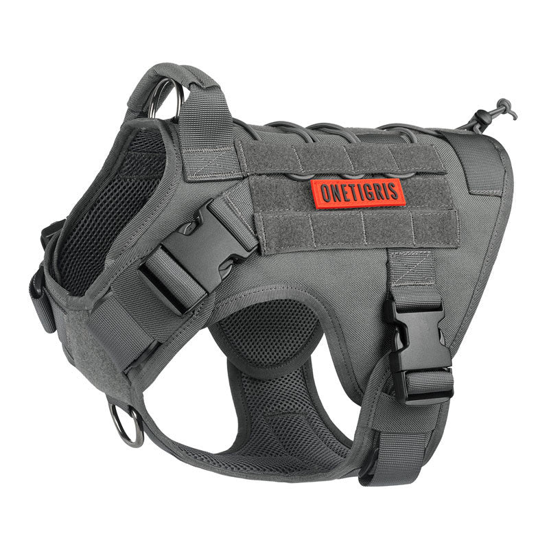 Gray dog harness with a red brand label on a white background