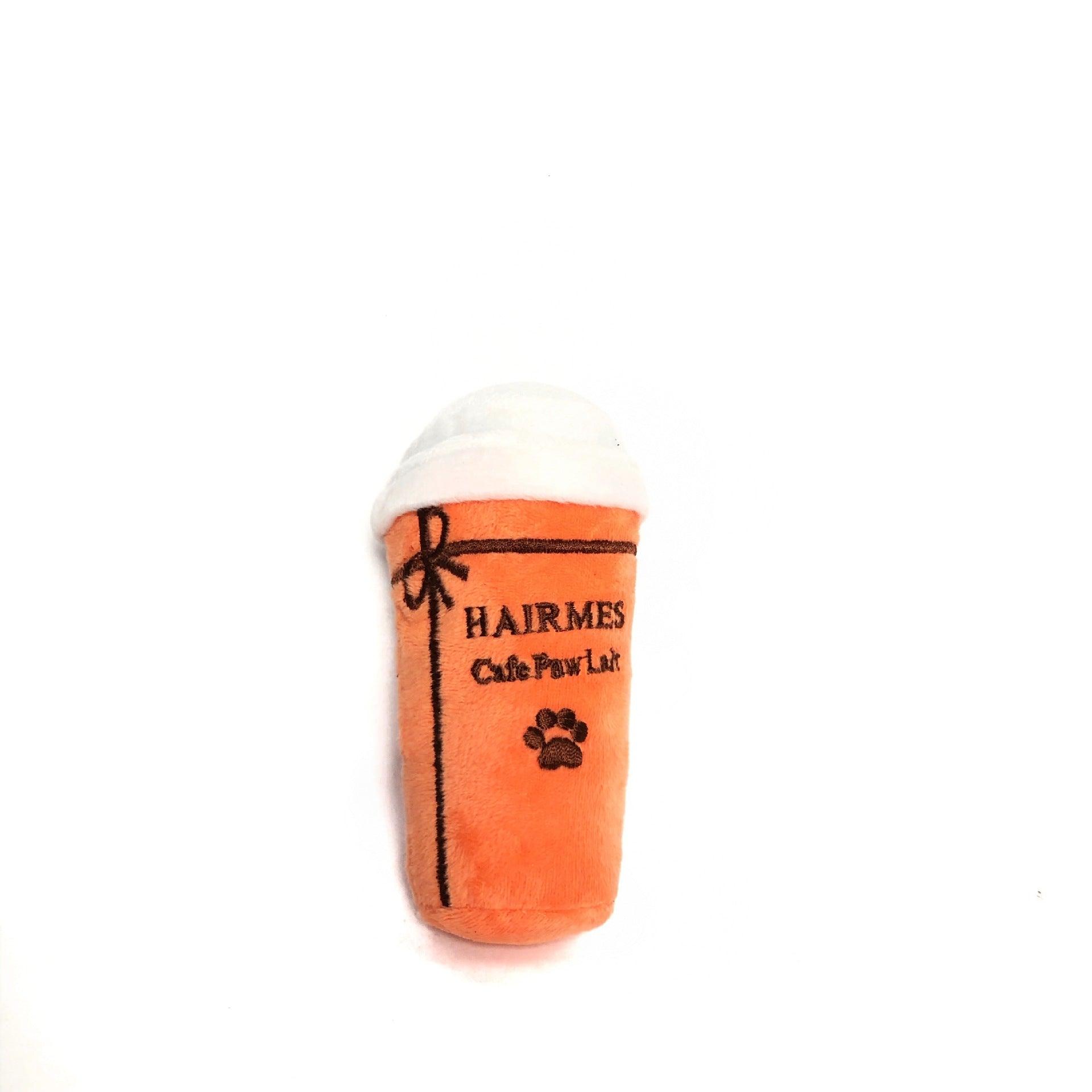 Toy resembling a coffee cup with 'Hairmes Cafe Paw Lab' text on a white background