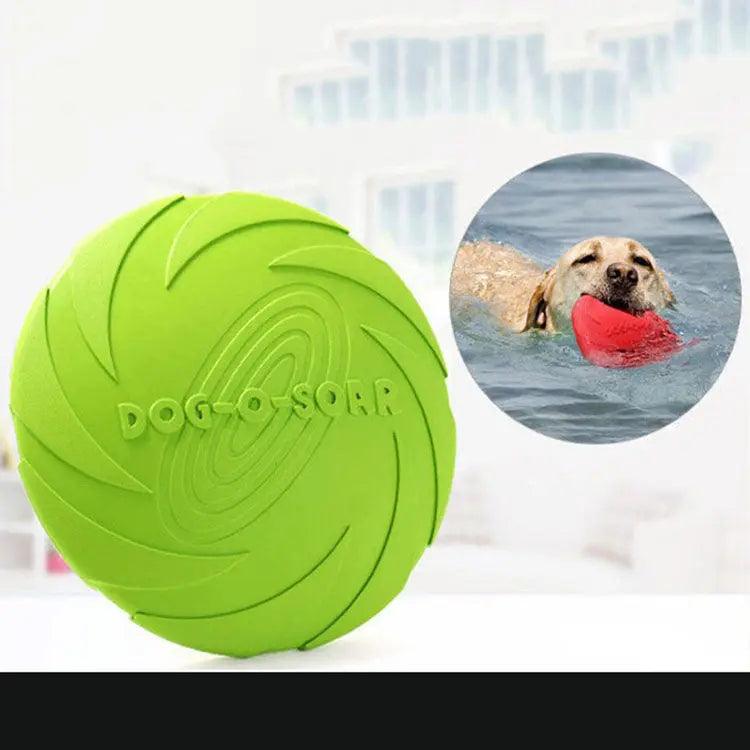 Green dog toy with 'Dog-o-Sorp' branding on a white background, inset with a dog playing with a red toy in water.