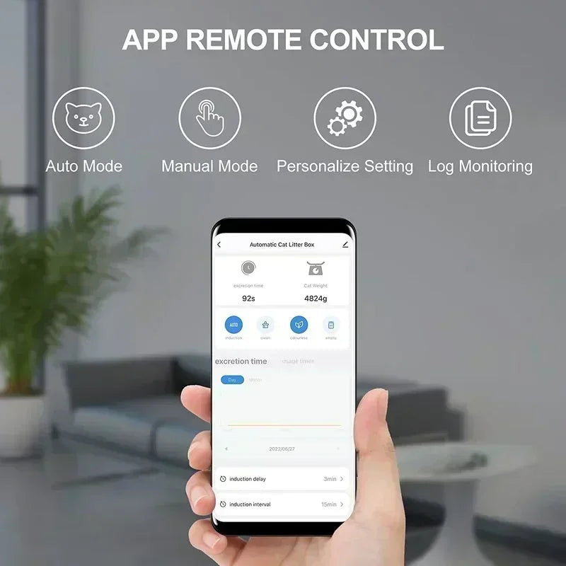 Hand holding a smartphone with app remote control interface on a blurred indoor background