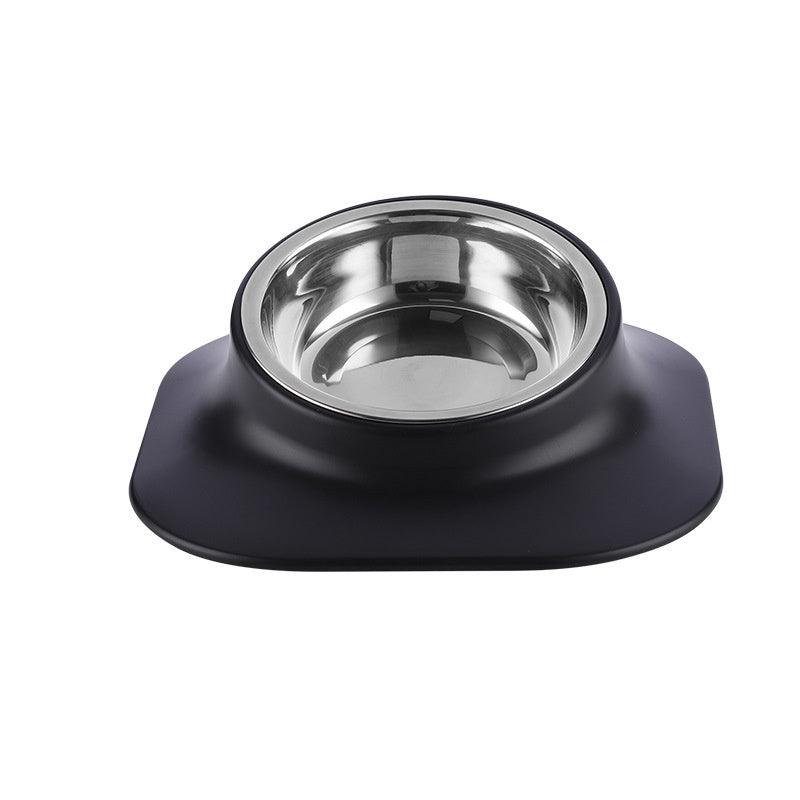 Stainless steel dog bowl with black silicone base on a white background